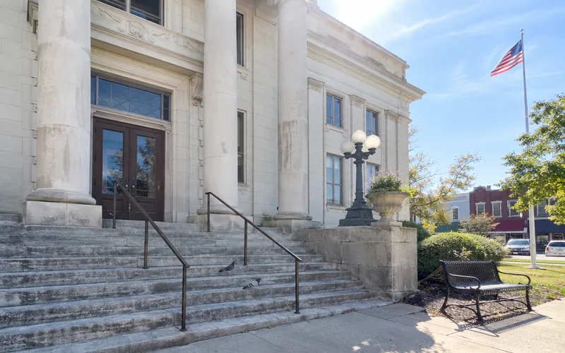 Stone front steps and columns of a small-town county courthouse