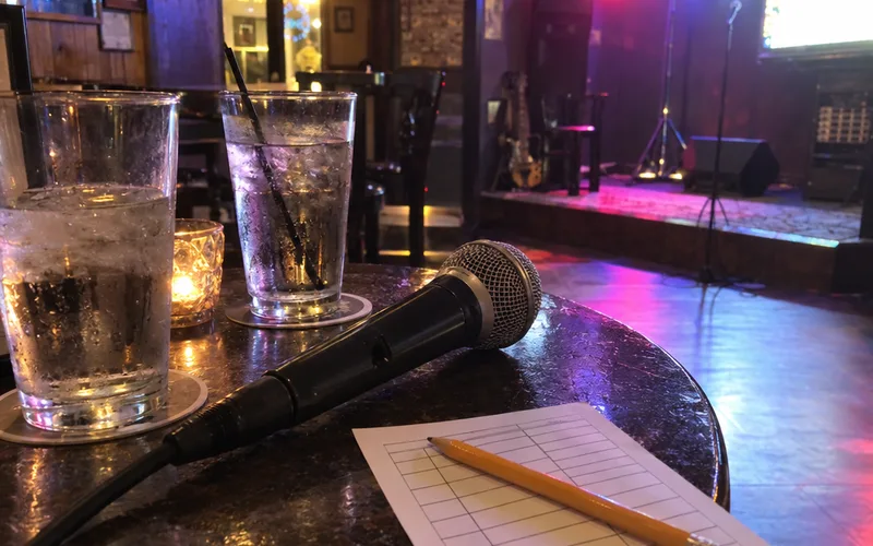 Karaoke microphone and song slip on a table in a neighborhood bar